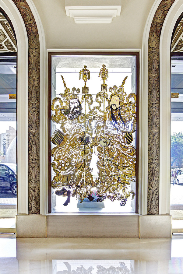 Chinese inspired deities by Chan Yi-dong enhance the entrance along with other historical themed décor.